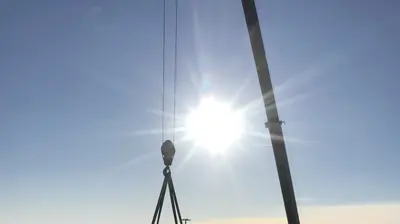 Crain lifting Chiller at Montgomery Mall Photo